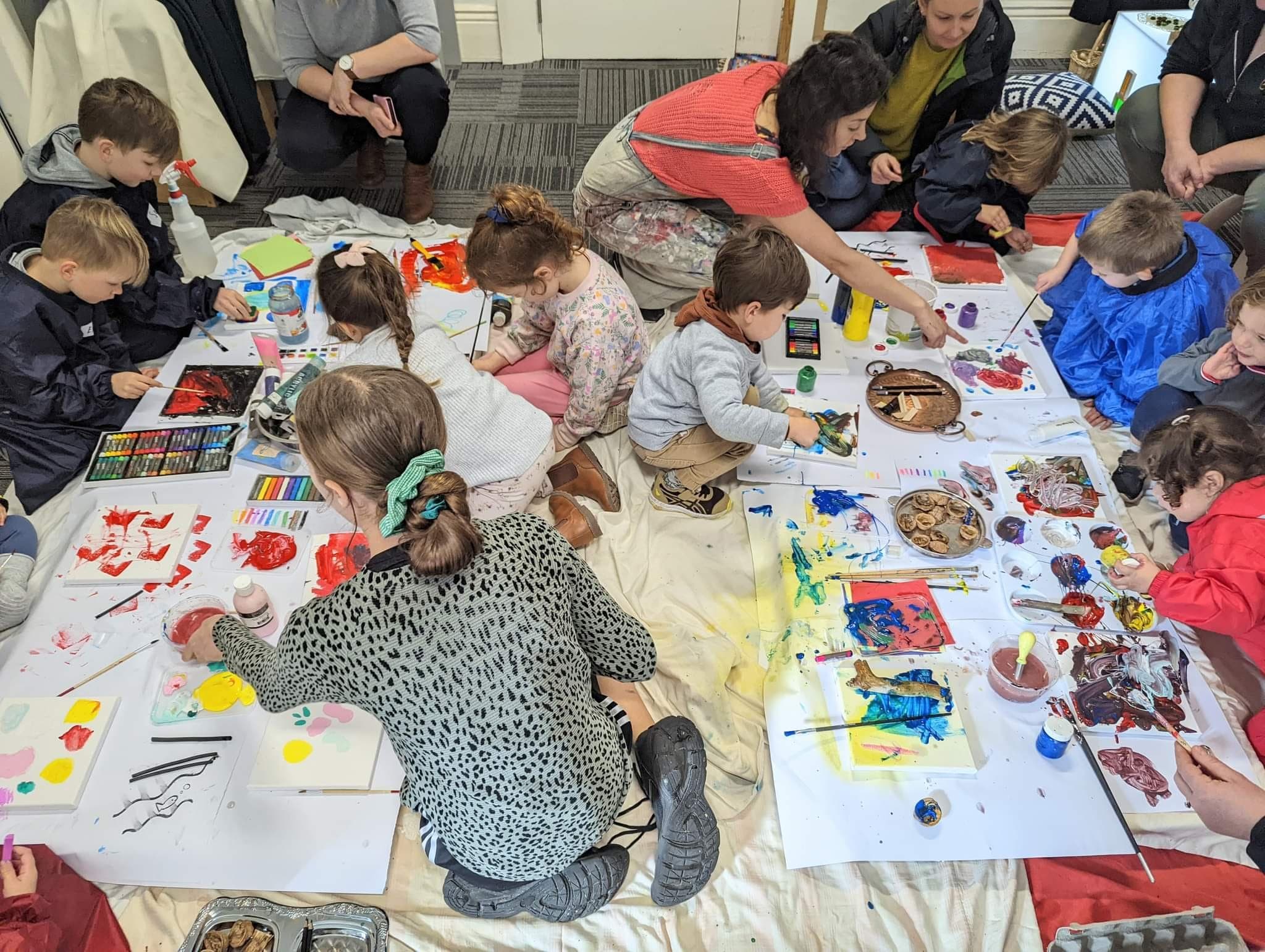 Children painting on the ground