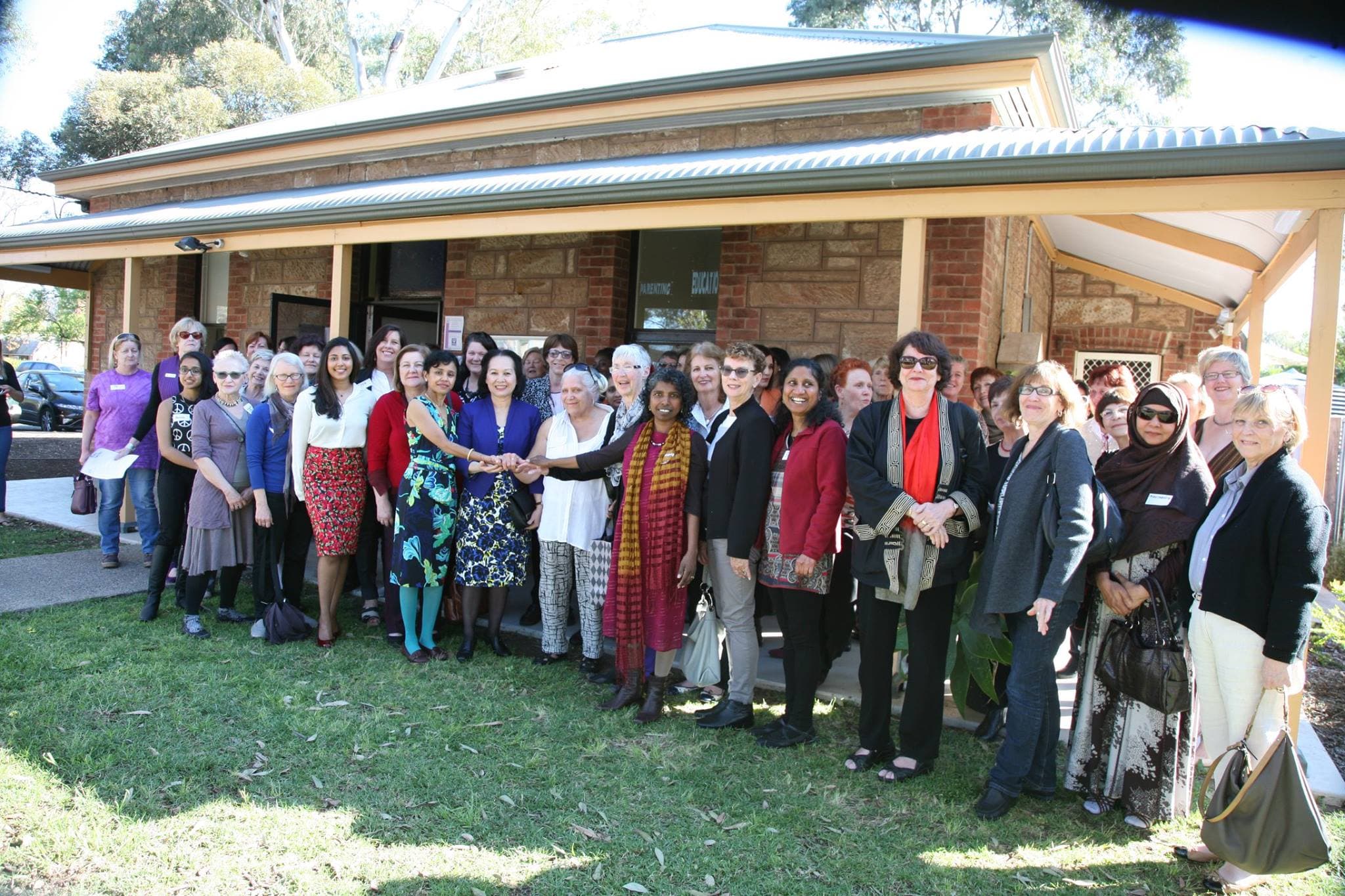 Group photo of WCCSA members in front of WCCSA building